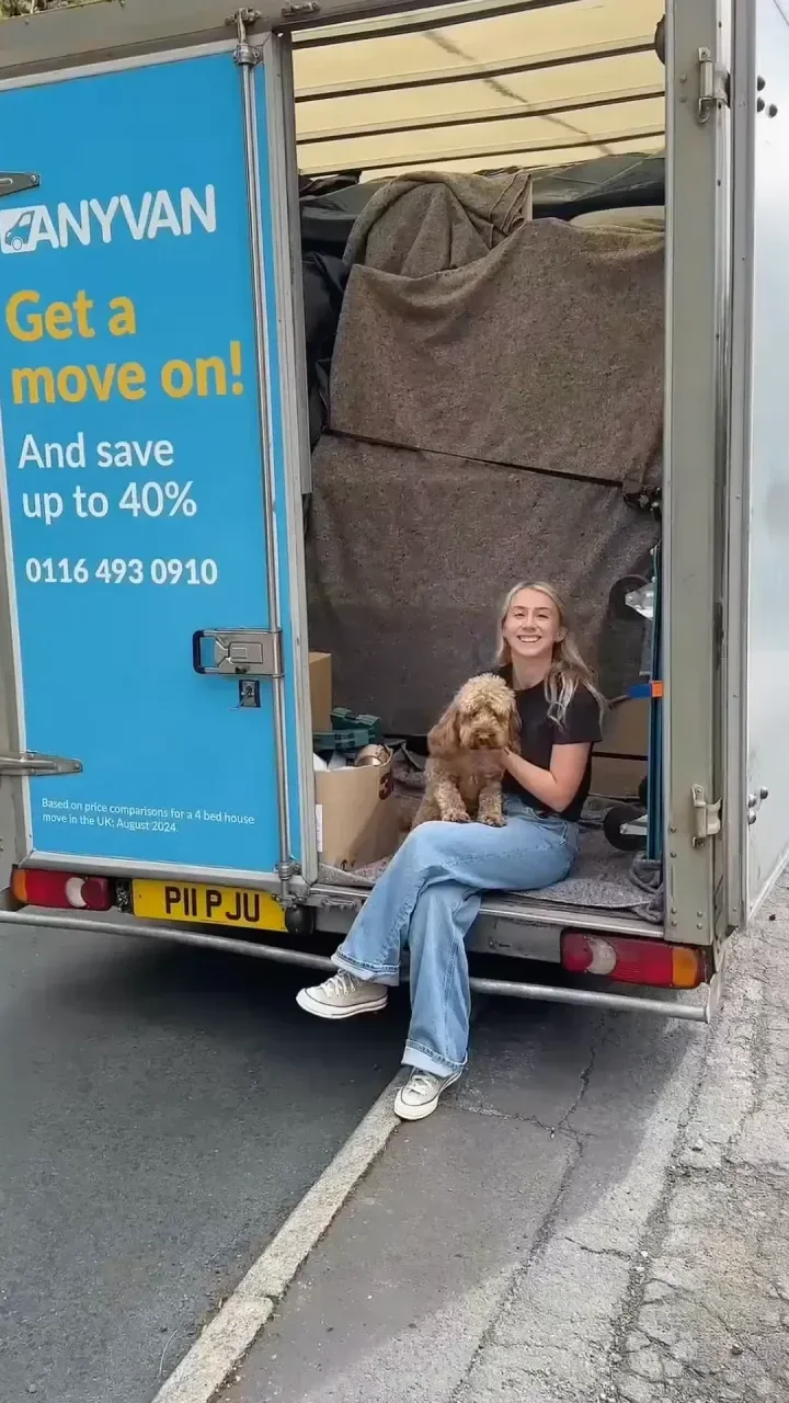 happy mover with her dog ready to move house
