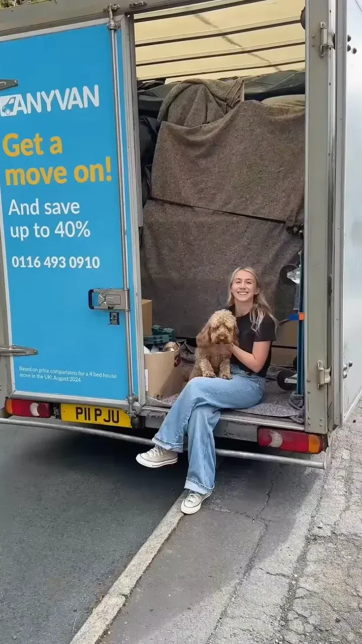 happy mover with her dog ready to move house
