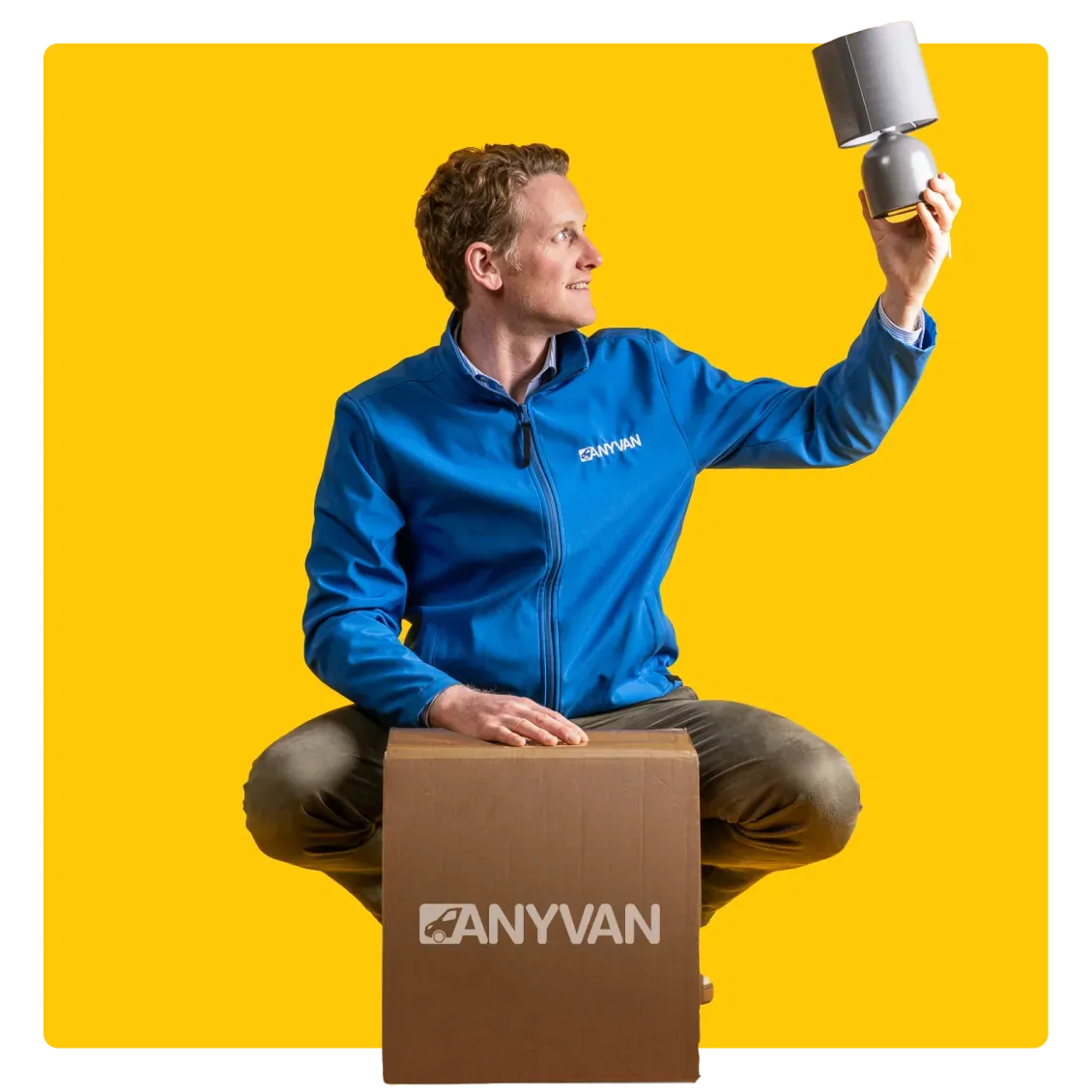 AnyVan founder Angus Elphinstone, holding a lamp 