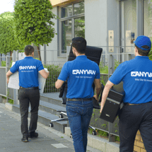 AnyVan drivers loading furniture into a van